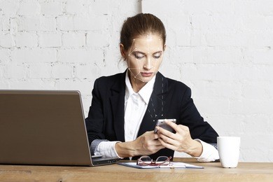 face identification of business woman with phone. biometric verification woman face recognition security.