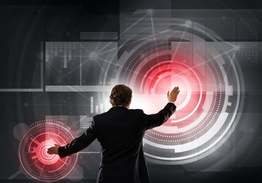 businessman standing with back and using media virtual screen