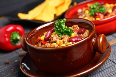 bowl of chili with peppers and beans