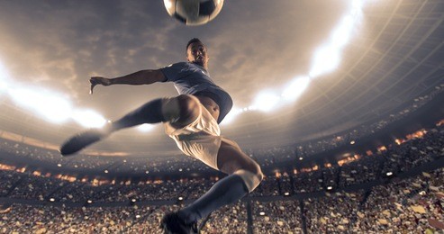 soccer player kicks the ball on the soccer stadium. he wear unbranded sports clothes. stadium and crowd made in 3d.