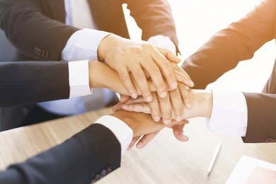 teamwork - business partners,friendship and togetherness collaboration concept. group of colleagues join hands together.