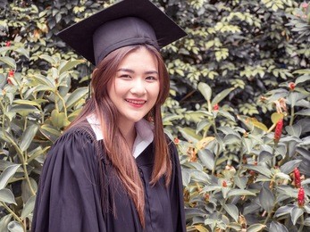 graduate woman students wearing graduation hat.woman student in graduation cap with certificate. happy woman on her graduation day university. education and people.