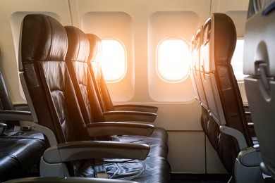 empty seats and window inside an aircraft