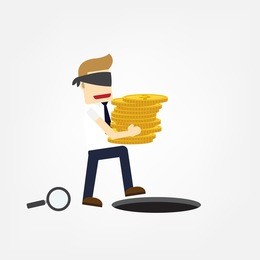 blind investment concept, clueless businessman hold gold coin walk to business trap