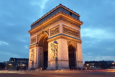 arc de triomphe in paris, france at night