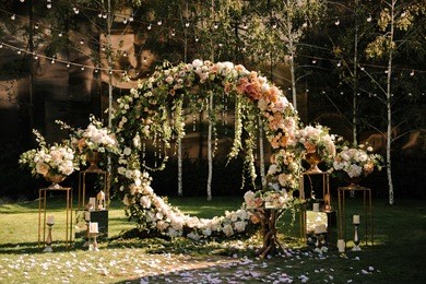 wedding. wedding ceremony. arch. arch, decorated with pink and white flowers standing in the woods, in the wedding ceremony area