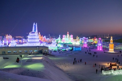 frozen city showing its vivid color at night in snow festival, harbin, china