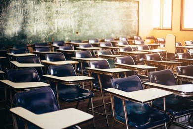 selective soft and blur focus.old wooden row lecture chairs in classroom in poor school.study room without student.