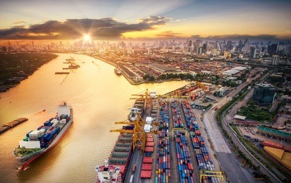 logistics and transportation of container cargo ship and cargo plane with working crane bridge in shipyard at sunrise, logistic import export and transport industry background