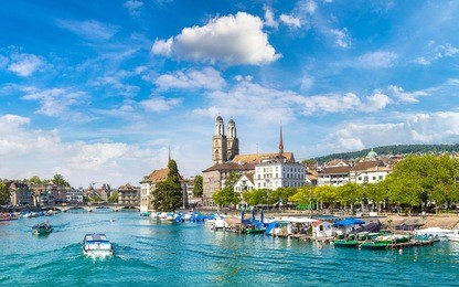 historical part of zurich with famous fraumunster and grossmunster churches in a beautiful summer day, switzerland