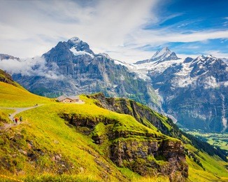 great summer view from the top of grindelwald first cableway. schreckhorn mountain in the morning mist, grindelwald village location, swiss bernese alps, switzerland, europe.