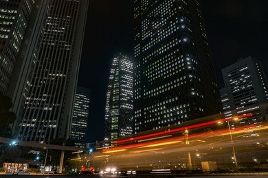 current of traffic with tall buildings in the night of shinjuku : the city night scene of tokyo.