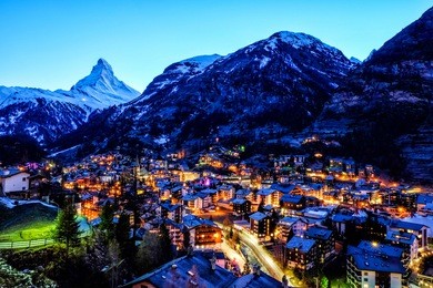 beautiful view of old village in twilight time with matterhorn peak background in zermatt, switzerland.