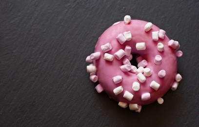 pink donut with mini marshmallows view from above