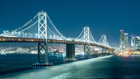 oakland bay bridge and the city light at night.