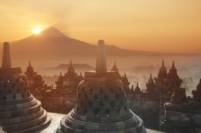 sunrise at borobodur temple indonesia with mount merapi vulcano