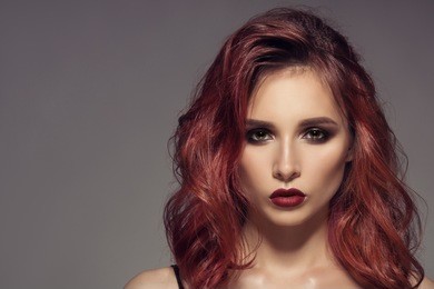 portrait of woman with long curly beautiful ginger hair.