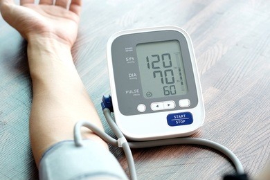 human check blood pressure monitor and heart rate monitor with digital pressure gauge. health care and  medical concept