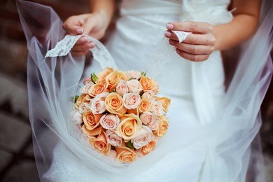 woman holding colorful bouquet with her hands on wedding day. beautiful wedding bunch of the bride.