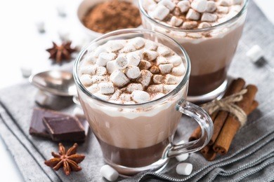 winter hot drink. hot chocolate or cocoa with marshmallow and spices. close up.