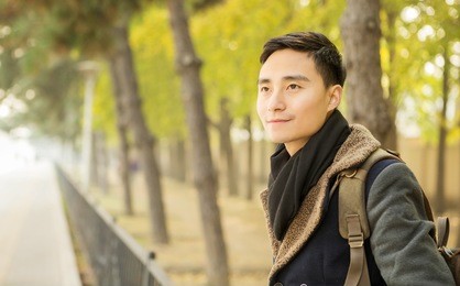 handsome asian men who admire the scenery in the park