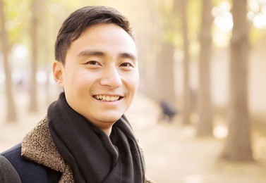 handsome asian men who admire the scenery in the park