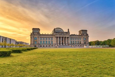berlin sunrise city skyline at reichstag, berlin, germany (german text = to german people)