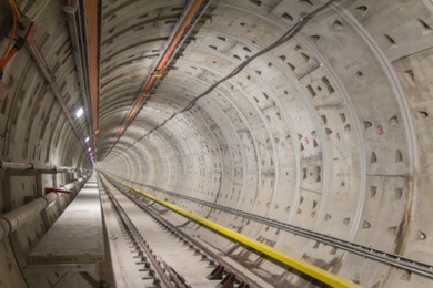 blurred photo of railway underground tunnel which install running and conductor rail