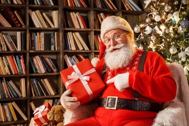 santa claus in the library christmas new year concept