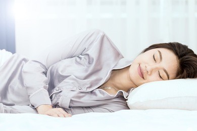beautiful asian woman sleep and sweet dream on bed in bedroom in the morning,healthcare concept