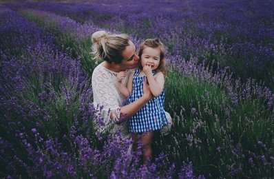 mother and daughter in a lavender field. mother's day concept.