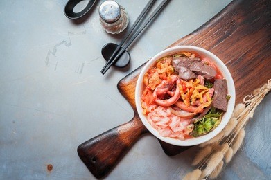 yen ta four, authentic thai style noodle soup with assorted tofu and fish ball, crispy wonton skin, and special homemade red or pink soup.