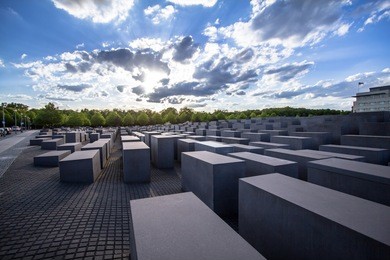 view of famous memorial of the jewish holocaust with the beautiful sky on the background, berlin, germany