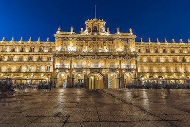 long exposure photography of plaza mayor, main square, with people walking, in salamanca night spain. city declared a unesco world heritage site in 1988