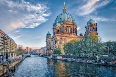 dramatic sky with berlin cathedral in berlin, germany.