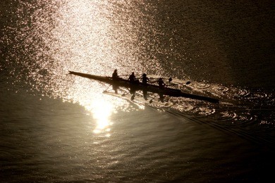 rowing team working out on a sunrise