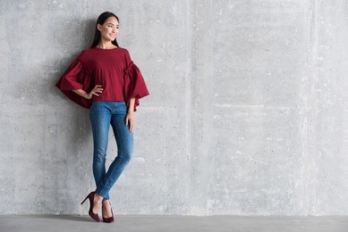 pleasant elegant girl is standing in office