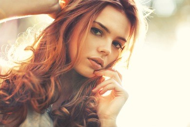 young woman outdoors portrait. soft sunny colors.