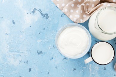 dairy products on stone table. sour cream and milk. top view with copy space