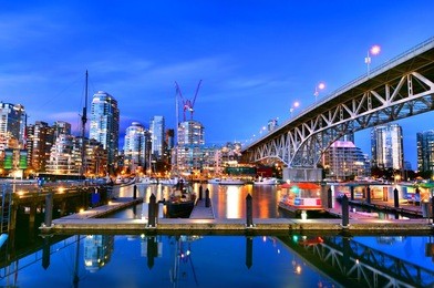 beautiful view of vancouver bc next to granville bridge along false creek at twilight time.