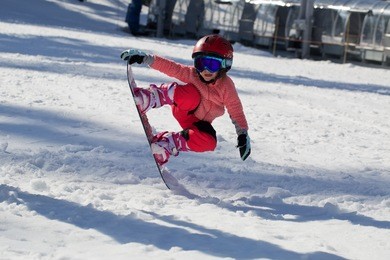 little girl snowboarding 