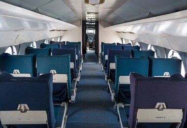 empty seat rows in commercial old aircraft cabin