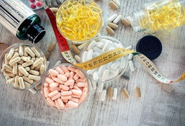 nutritional supplements in capsules and tablets. selective focus, shallow dof
