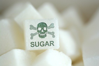 sugar cubes with human skull symbol, suggesting unhealthy and dangerous food