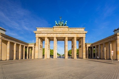 the brandenburg gate in berlin at sunrise, germany