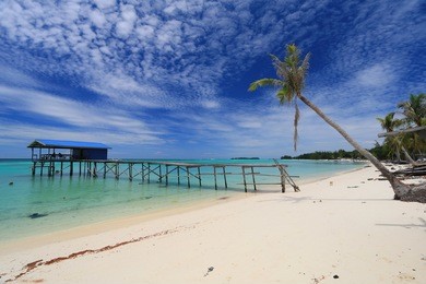beautiful scenery of white sand beach with blue sky ocean and green ocean in mantanani island, north borneo  
