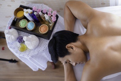 young handsome mand in spa massage salon