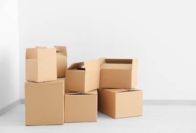 move house concept. carton boxes on floor in empty room