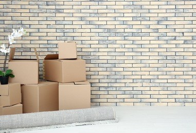 move house concept. carton boxes on floor in empty room