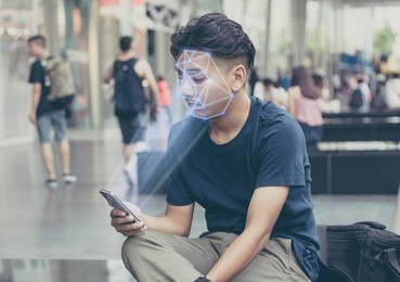 face recognition concept.hispter man using mobile phone